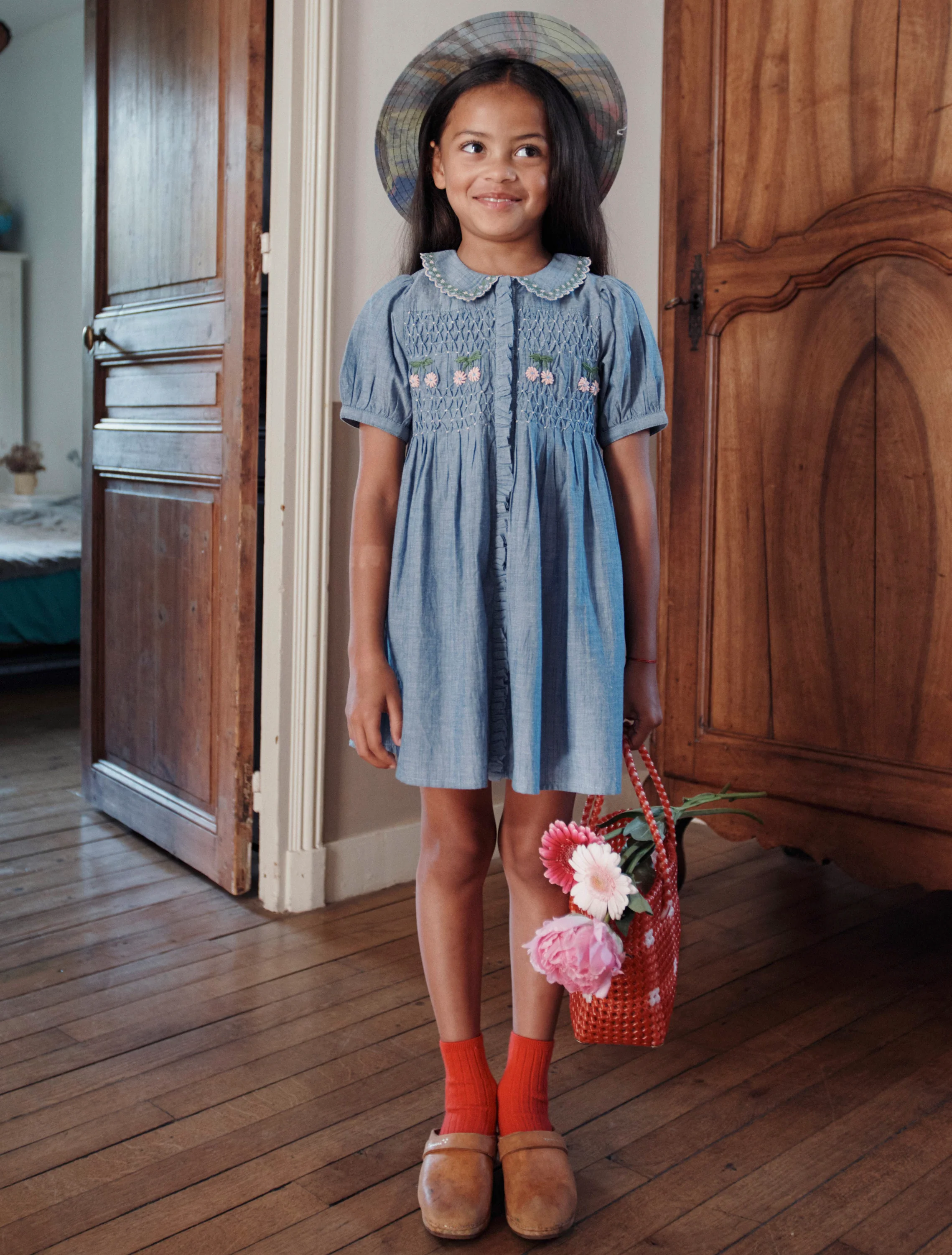 Hand-Embroidered Smocked Dress in Chambray - Image 2